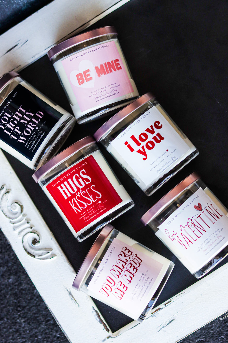 A collection of Valentine's Day candles in 9 oz whiskey glass jars, featuring romantic and playful labels designed for the holiday season. Perfect for gifting and spreading love.