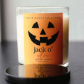 Load image into Gallery viewer, Jack O'Glow Halloween Scented Soy Candle in 9 oz whiskey glass jar with black lid
