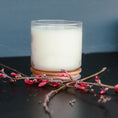 Load image into Gallery viewer, Cedar Mountain Candle 3-wick white soy wax candle in a clear glass jar with a bamboo lid, adorned with pink flowers.
