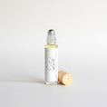 Load image into Gallery viewer, Cedar Mountain Candle Exotic Beach roll-on perfume oil with pineapple, hibiscus, and coconut milk notes in a 10ml glass bottle.
