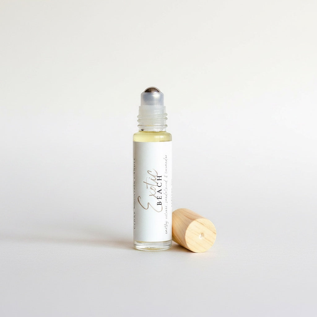Cedar Mountain Candle Exotic Beach roll-on perfume oil with pineapple, hibiscus, and coconut milk notes in a 10ml glass bottle.