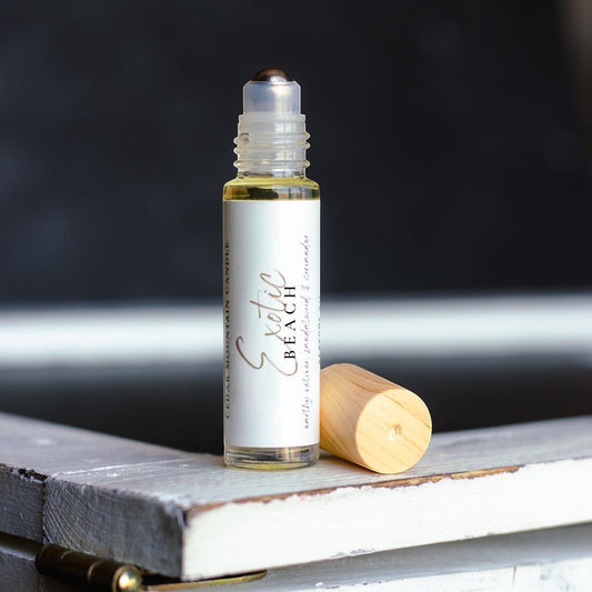 Cedar Mountain Candle Exotic Beach roll-on perfume oil with pineapple, hibiscus, and coconut milk notes. 10ml glass bottle with bamboo lid.